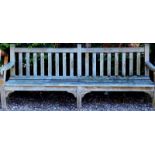 A large teak slatted garden bench, 246cm wide, etc.