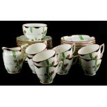 A Mintons Art Deco style part tea service, each piece decorated with flowers, leaves, etc., some pie