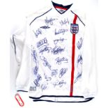 An England football shirt, bearing various signatures, size XL. (AF)