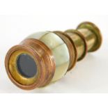 A 19thC miniature brass and copper two draw spy glass or monocular telescope, with a band of mother
