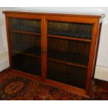A late Victorian mahogany glazed bookcase, with moulded top two glazed doors, and plinth, 92cm high,