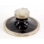 An Edwardian silver and tortoise shell finish capstan inkwell, of circular form with hinged lid and