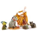 A collection of ceramic figures, to include a Royal Doulton Eeyore figure, Royal Doulton Lady Kitty,