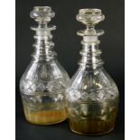 A pair of Georgian ring necked mallet shaped decanters, with cut banding and slice cut decoration, h