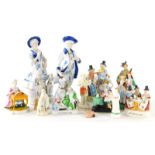 Various pottery and porcelain figures, crinoline ladies, a Welsh tea party group, etc.