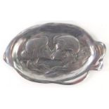 An Art Nouveau pewter oval dish, with two figures about to kiss, 27cm.