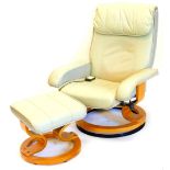 A green leather electric massage armchair, on swivel base, with matching stool.