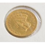 An 1874 gold USA one dollar coin, in presentation cardboard sleeve.