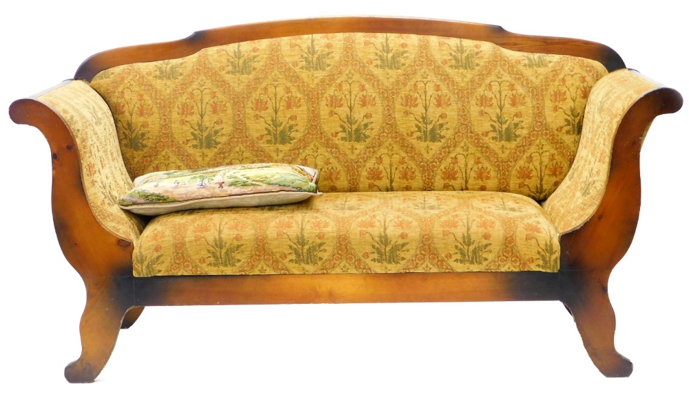 A continental Beidermeier type sofa, with a stained pine frame upholstered in patterned gold coloure