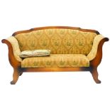 A continental Beidermeier type sofa, with a stained pine frame upholstered in patterned gold coloure
