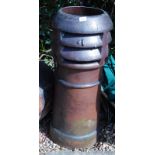 A stoneware chimney pot, with pierced decoration to the top, 88cm high.