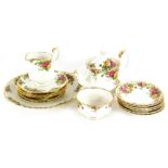 A Royal Albert Old Country Roses pattern, milk jug, sugar bowl, side plates, saucers, and a teapot (
