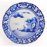 A modern Japanese blue and white painted charger, with lake and landscape decoration, 34cm diameter.