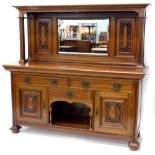 A late 19th/early 20thC walnut sideboard, the raised back with central bevelled mirror plate, flanke