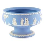 A 20thC Wedgwood blue Jasperware bowl, decorated with an all round classical scene, impressed