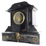 A late 19thC French black slate and bronzed metal mantel clock, decorated with Neoclassical masks, f