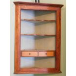 A George II oak hanging corner cabinet, with shelves and later drawers.