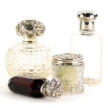A quantity of small silver mounted items, to include a scent bottle with an embossed cover (stopper