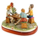 A Capodimonte porcelain group The Cheat, indistinctly signed and numbered 330, on a wooden base, 42c