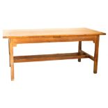 A 19thC French farmhouse kitchen table, the planked top with cleated ends, on square tapering legs w