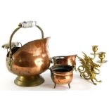 A collection of metal ware, to include a pair of brass griffin shaped candlesticks, copper coal scut