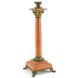 A red variegated marble and gilt metal table lamp base, (AF), 48 cm high.