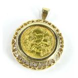 A George V half gold sovereign pendant, dated 1913, in a raised and pierced 9ct gold frame, 6.7g all