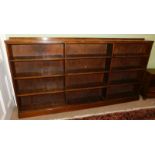 Withdrawn presale by vendor- An oak open bookcase, 122cm high, 235cm wide, 24cm deep.