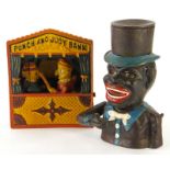 A reproduction metal money box Punch and Judy bank, 19cm high, and another. (2)