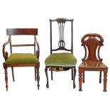 A Victorian mahogany hall chair, with a shield shape back, a 19thC mahogany open arm chair, and an E