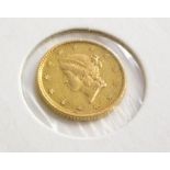 An 1854 gold USA one dollar, in presentation sleeve.