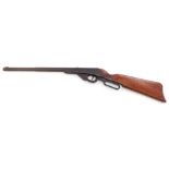 A vintage air rifle, unmarked with stained pine stock, 84cm long.