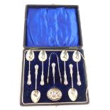 A set of six George V silver teaspoons, with matching sugar tongs and sifter spoon, cased, Birmingha