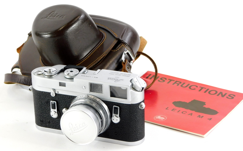 A Leica M4 camera, serial number 1270524, with a Leitz 5cm f2 Summicron lens, number 1156983, in a l