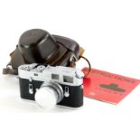 A Leica M4 camera, serial number 1270524, with a Leitz 5cm f2 Summicron lens, number 1156983, in a l