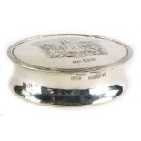 An Edward VII silver oval box, with hinged lid embossed decoration, The Hon The Irish Society, Chest