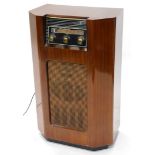 An Ekco freestanding vintage radio, in walnut case, 81cm high, 50cm wide.
