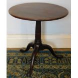 A George III mahogany occasional table, with circular tilt top, reeded and fluted taper column on th
