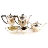 A matched five piece tea/coffee service, with half ribbed body comprising two handled sugar bowl, Lo