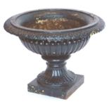 A Victorian cast iron garden vase or urn, of Campana form with egg and dart decoration to the rim an
