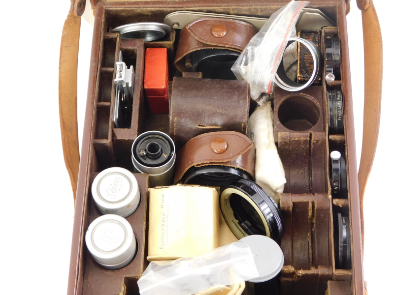 A brown leather Leitz Leica case, containing mixed Leica accessories. - Image 2 of 2