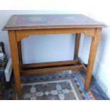 An Edwardian oak occasional table, with an Art Nouveau tile top, 76cm x 45cm.