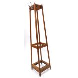 An oak square section coat stand, of tapering form, hooks (AF), 183cm high.