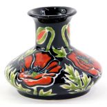 A Cobridge ceramic squat vase, decorated with poppies, in the manner of Moorcroft, impressed and pri