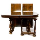 A French walnut extending dining table, the rectangular top with a moulded edge, on two pairs of tur