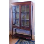 An Edwardian string inlaid mahogany display cabinet, with two astragal glazed doors, over two drawer