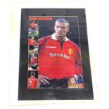 A football poster of David Beckham playing for Manchester United, bearing signature, framed, 80cm x