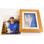 A leather golf glove, bearing signature and a photograph. (2)