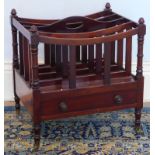 A Victorian mahogany Canterbury, with turned uprights single drawer and brass cup castors, 50cm wide