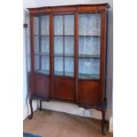 An Edwardian mahogany string inlaid display cabinet, with serpentine side doors and astragal glazed